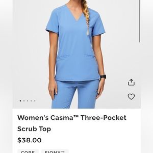 FIGS Casma Three Pocket Scrub Top in Ceil Blue. Size Small